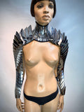 futuristic costume armadillo armour segmented neck and shoulder, cyber arm, shoulder armor