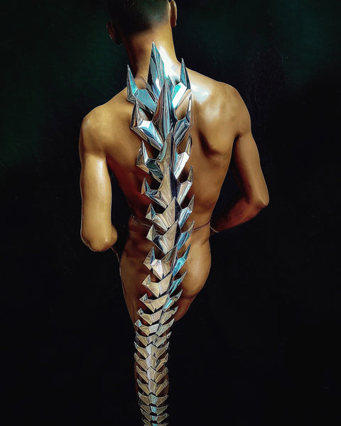 futuristic 5 feet chrome tail vertebra , column in silver chrome, stage costume, burning man, designer wear