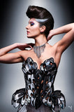 Chrome art nouveau inspired corset , burlesque performer futuristic gear