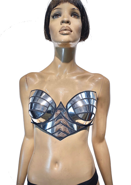 Premium Photo  White metal bra as part of the armor on a blue background  fantasy protection style fashion corset high definition art generative  artificial intelligence
